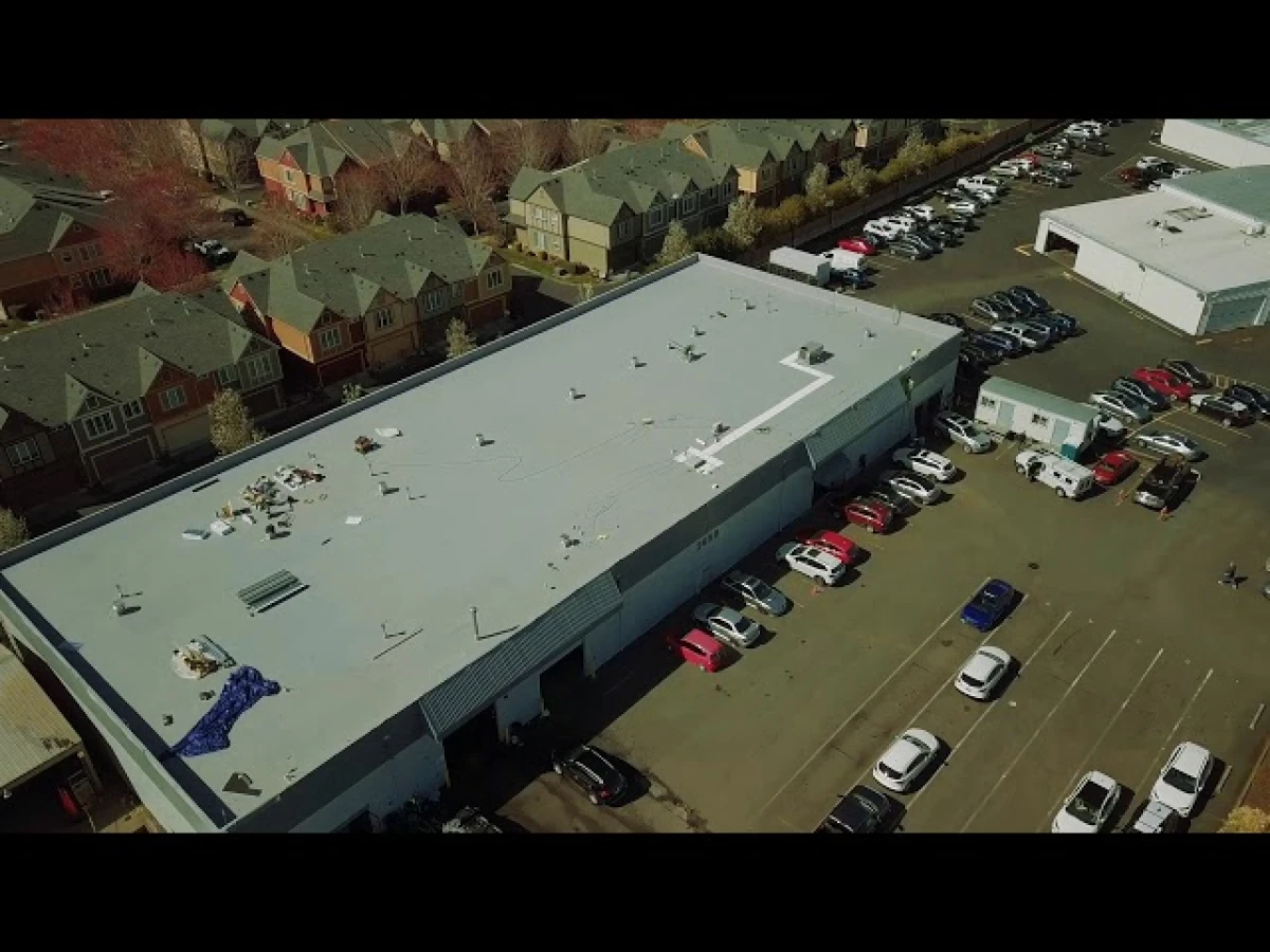 AMW Roofing installing a Versico 60Mil TPO mechanically fastened system over a customer's roof.